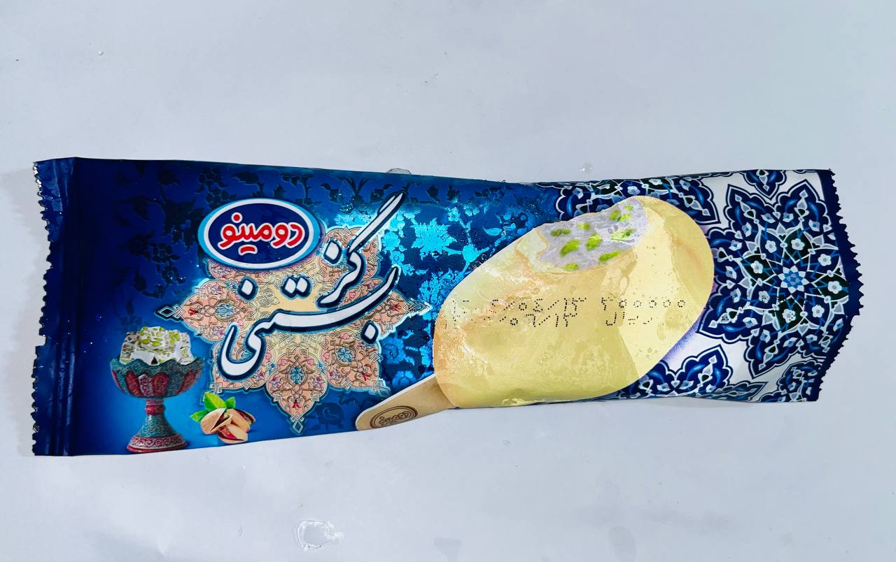 بستنی پاستوریزه گز با روکش شیری و مغز پسته ( مخلوط با چربی نباتی ) دومینو [ 65 گرم ]